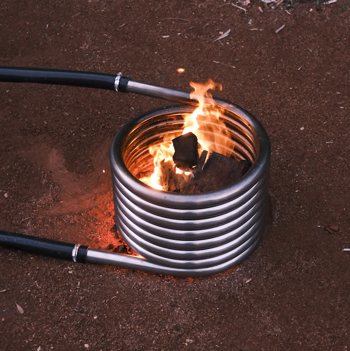 Off grid wood fired coil kit with fire close up