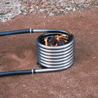 Off grid wood fired coil kit with fire outdoors
